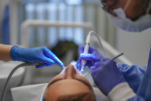 Close up to dental tools in dentist's hand