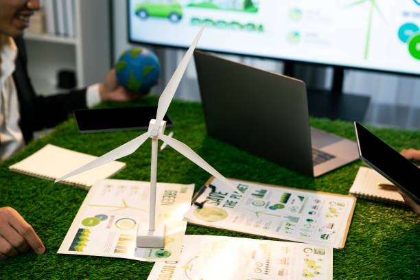 istock Diverse group of business people planning for alternative energy. Quaint 1997082583