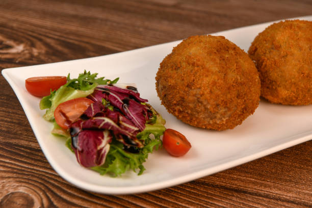 istock RECIPE FOR BREADED BEEF MEATBALLS STUFFED WITH A SOFT BOILED EGG 1997083058