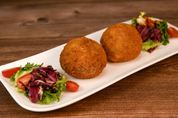 istock RECIPE FOR BREADED BEEF MEATBALLS STUFFED WITH A SOFT BOILED EGG 1997083178