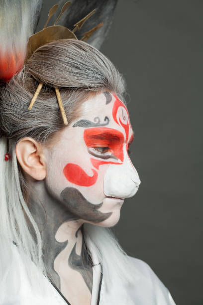 istock Beautiful female face with creative makeup close up 1997097363