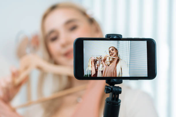 istock Young woman making fashion video content for social media. Blithe 1997126384