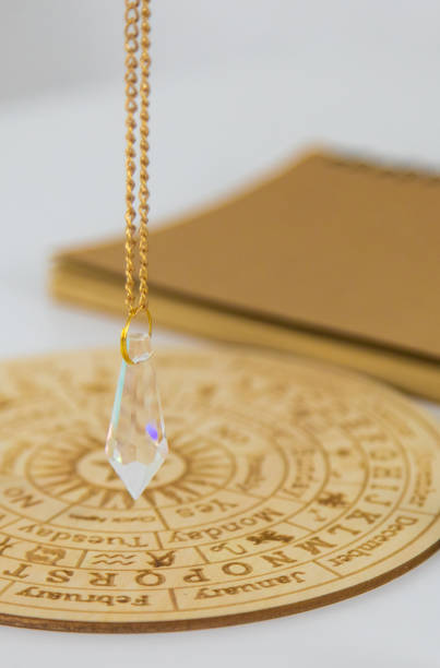 Pendulum numerologist astrologer and zodiac signs. Selective focus. Nature.