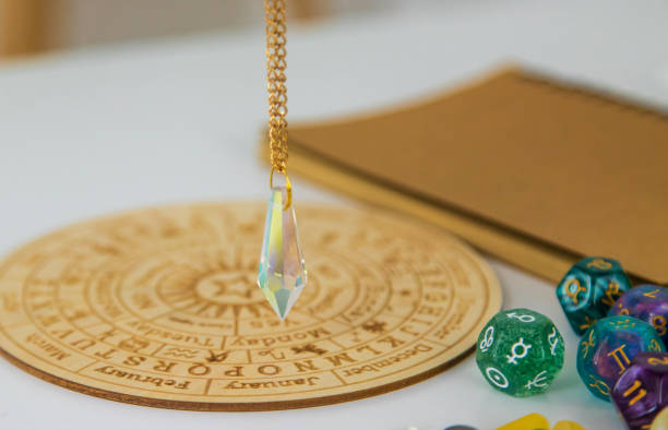 Pendulum numerologist astrologer and zodiac signs. Selective focus. Pendulum numerologist astrologer and zodiac signs. Selective focus. Nature. crystal altar stock pictures, royalty-free photos & images