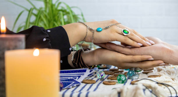istock A fortune teller reads with tarot cards. Selective focus. 1997162276