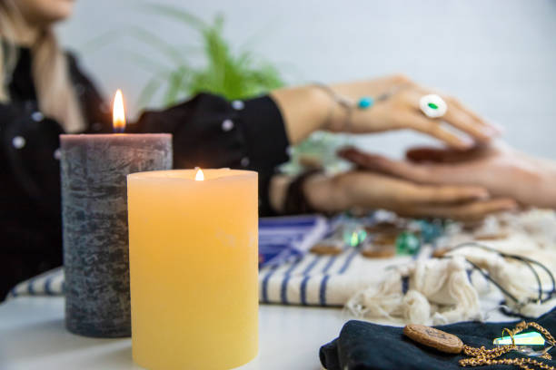 istock A fortune teller reads with tarot cards. Selective focus. 1997162288