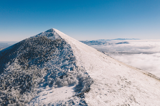 Aerial view of pyramid shape of Rtanj mountain peak in the winter.