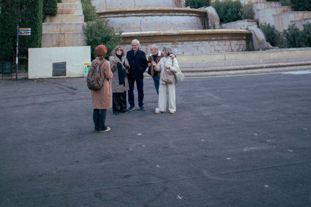 istock Senior friends with guide visiting the city 1997171331
