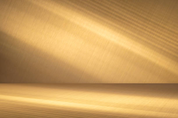 istock Wall interior background, studio and backdrops show products.with shadow from window color Gold. background for text insertion and presentation product 1997179455
