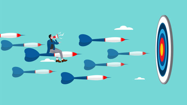 istock business or marketing target strategy, aim the target audience, introduce products or promotions to the right target audience, businessman control dart with megaphone to reach perfect target 1997180901