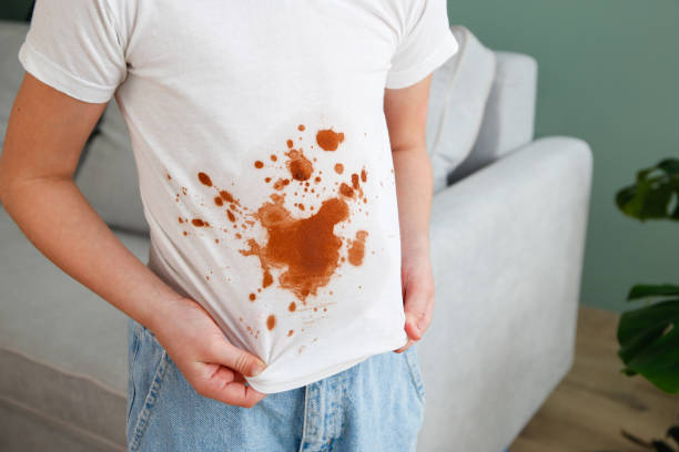 istock A white deodorant stain on black t-shirt. 1997214056
