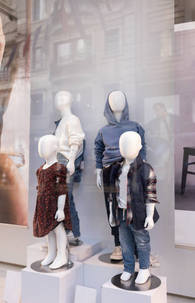 istock Children's clothing store, display case with 4 mannequins 1997222005