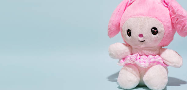 Cute and fluffy children's toy. Can be used as a space for writing on the left side. Playtime for girls. Early education concept.