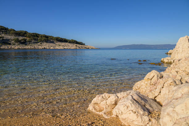 A bay by the sea in Cres (Croatia) on a beautiful day, sunlight, blue sky