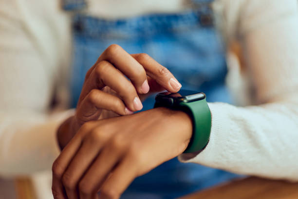 istock Close-up of a female using her wireless smartwatch. 1997238104