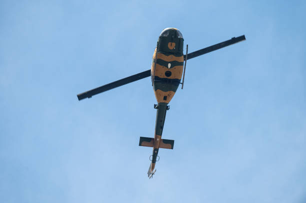 istock Military helicopter flying in the sky. 1997240253