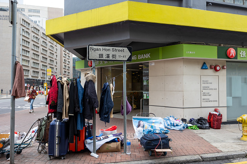 Hong Kong - February 9, 2024 : Clothes are seen hanging in the Ngan Hon Street in To Kwa Wan, Kowloon, Hong Kong.