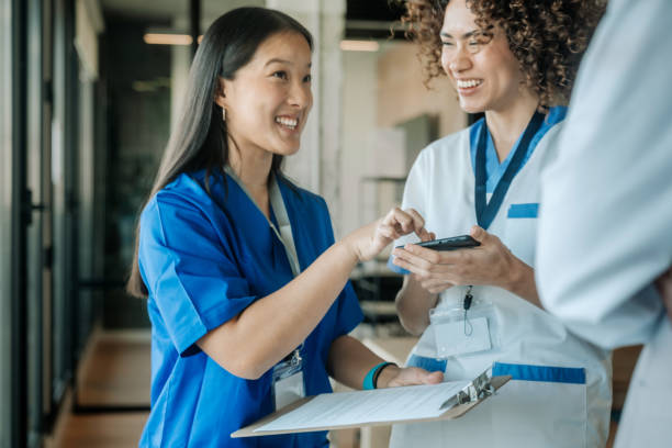 istock Nurses and doctor chatting at the hospital 1997258806