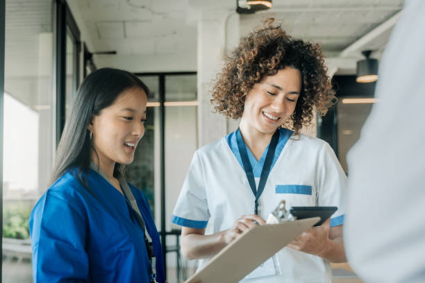 istock Nurses and doctor chatting at the hospital 1997258809