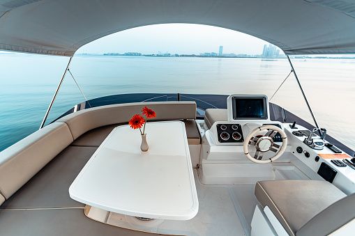 Flybridge and helm station of a luxury motor yacht