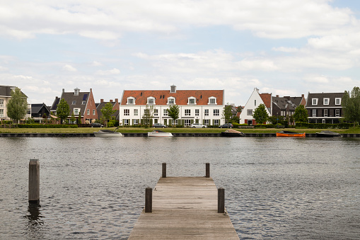 New modern residential buildings along the canal in the Waterfront district in the city of Harderwijk.