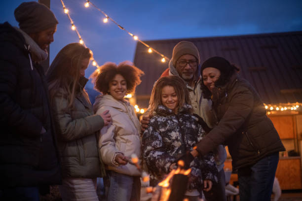 istock Family enjoying the outdoors fireplace 1997311022