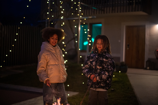 Kids enjoying the outdoors fireplace