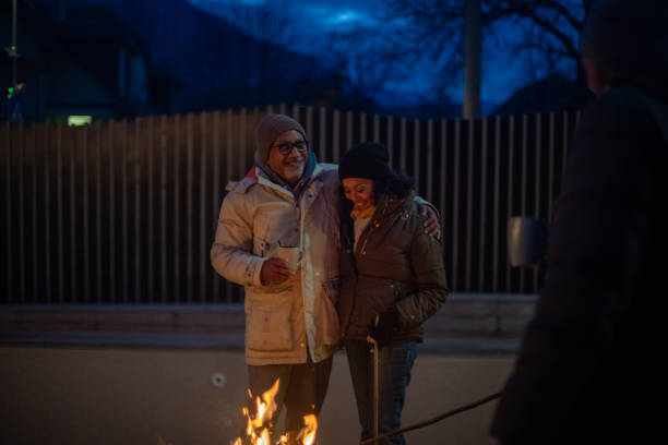 istock Elderly couple enjoying the outdoors fireplace 1997315750