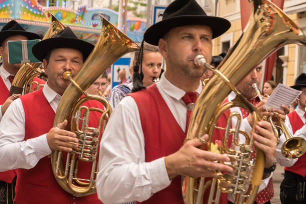 Opening parade: Entry of the Wiesn innkeepers at the Munich Beer Festival 2025, Bavarian Band Leads Parade With Drums And Brass