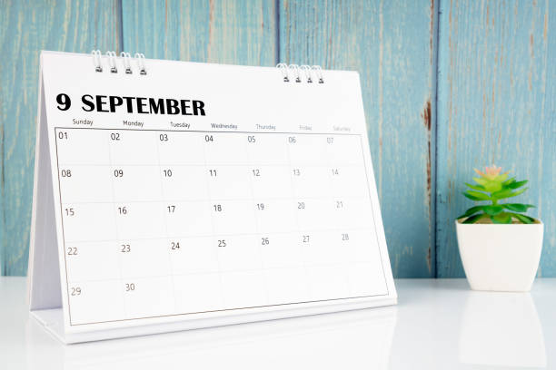 istock September 2024 calendar on the white table with wooden background. 1997344297