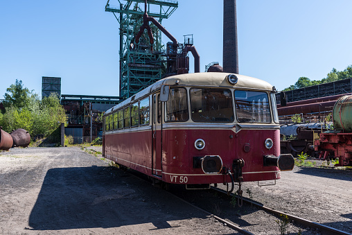 Hattingen, Germany - August 9, 2022: Red rail bus for transporting workers in the disused ironworks Henrichshuette, industrial museum, Hattingen, North Rhine-Westphalia, Germany