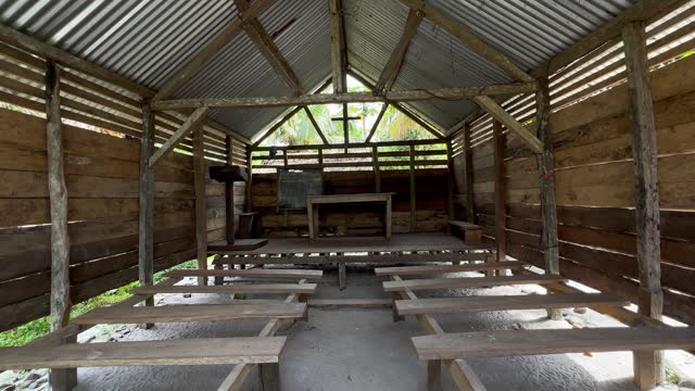 Interior view of a simple wooden Christian church in the village of Masoala, Madagascar.