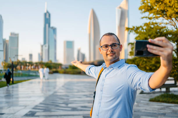 istock Young Man Taking Selfies In The Al Shaheed Park In Kuwait City 1997379171