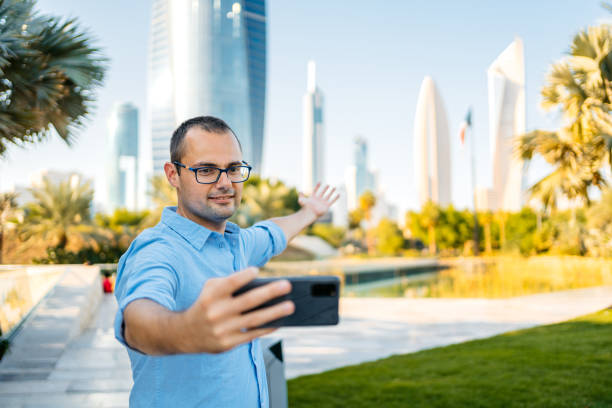 istock Young Man Taking Selfies In The Al Shaheed Park In Kuwait City 1997379681
