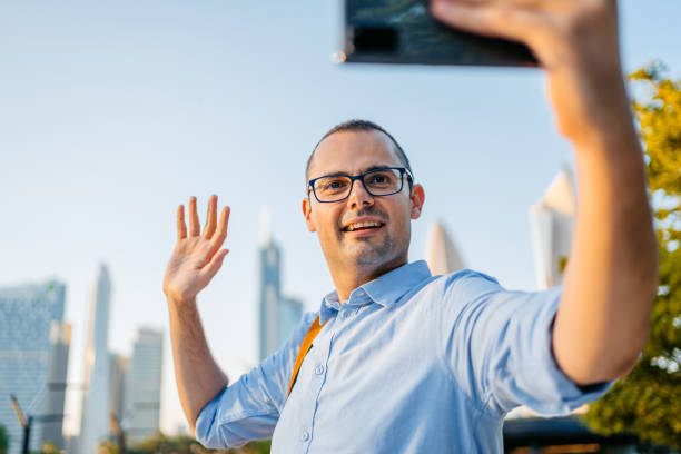 istock Young Man Having A Video Call In The Al Shaheed Park In Kuwait City 1997383331