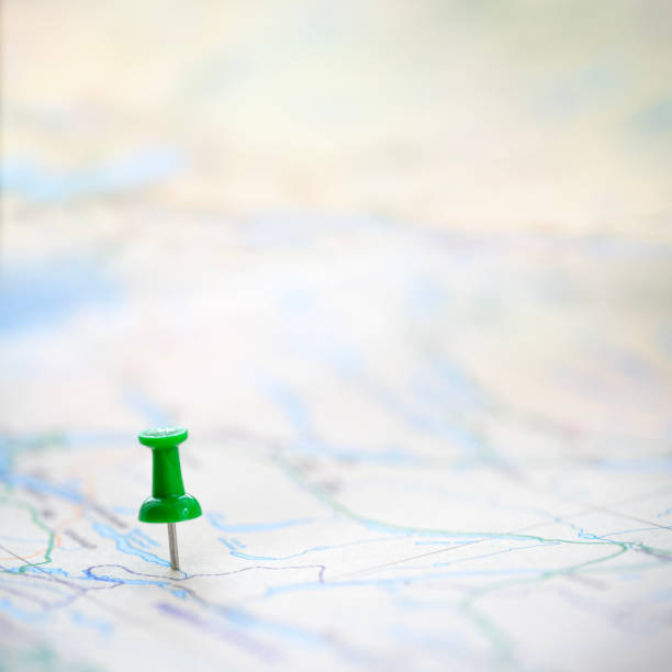 istock Green thumbtack marking and showing destination location point on map background with copy space 1997403420