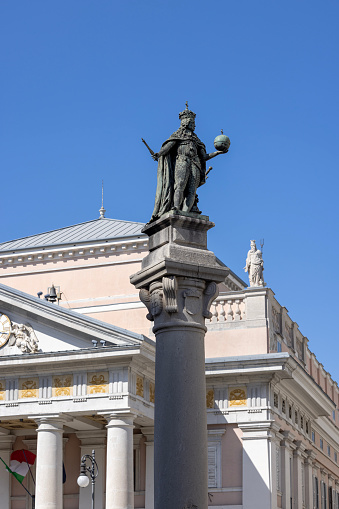 Trieste, Italy - September 26, 2023:  Statue of Leopold I, Holy Roman Emperor and Habsburg Emperor. Column is located on Stock Exchange Square