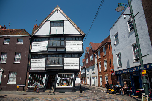 Canterbury, Kent, June 10 2023: Bookshop in a crooked leaning house on canterbury palace street in a leaning traditional British building.