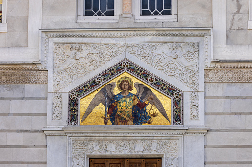 Trieste, Italy - September 26, 2023: Facade of 18th century orthodox Saint Spyridon Church located at Piazza Sant'Antonio Nuovo. Decorative mosaic