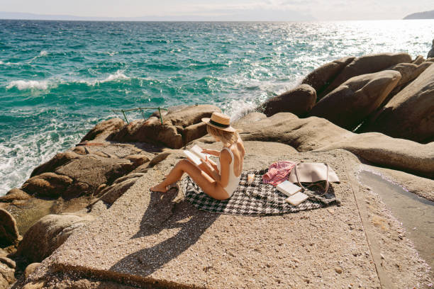 Photo of a woman traveling solo by the sea