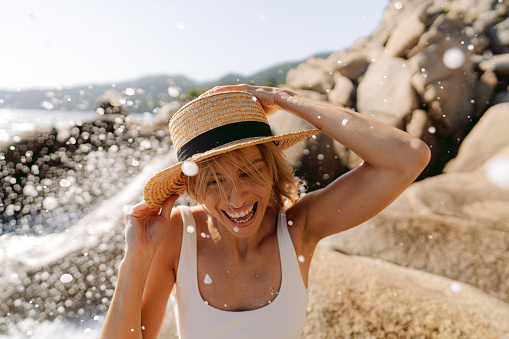 Photo of a woman traveling solo by the sea