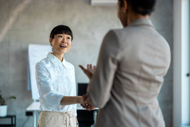istock Female customer shaking hands with real estate agent 1997461625