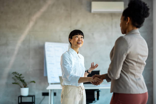 istock A handshake to congratulate a coworker on their promotion 1997462505