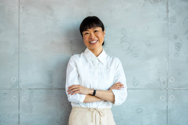 istock Smiling businesswoman posing in modern office 1997462662
