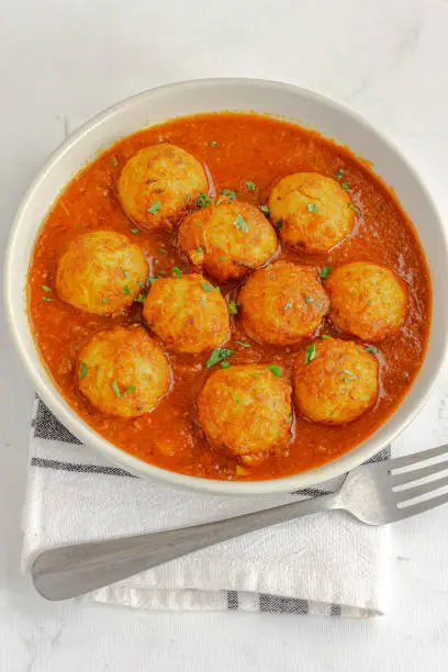 Chicken Meatballs with Spicy Sauce Made with Tomato, Garnished with Fresh Cilantro