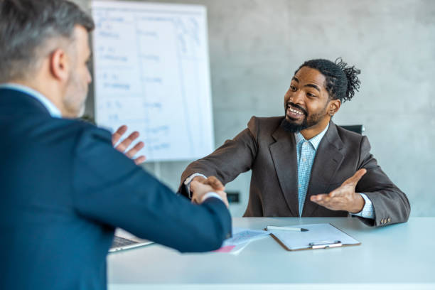 istock Handshaking between business partners after making a deal indoors 1997464393