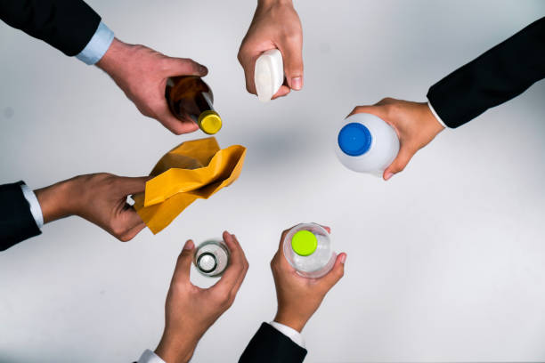 istock Businessman's hand holding garbage waste on isolated background. Quaint 1997486928