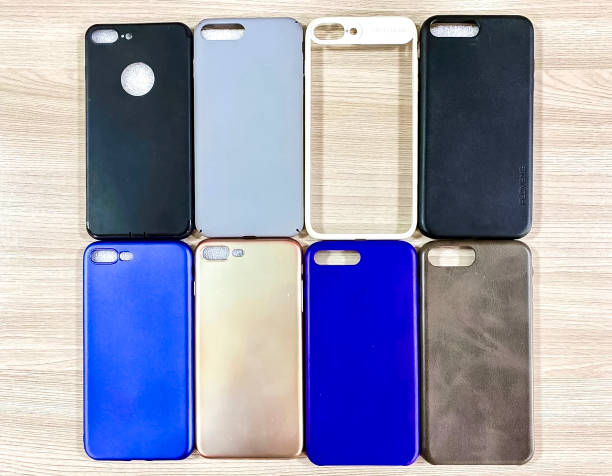 istock Colorful mobile phone cases on the wooden table. Top view. 1997489041