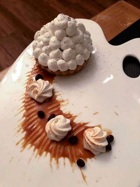 istock A cake with whipped cream and coffee beans on a white plate 1997490725