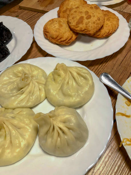 istock Georgian dumplings khinkali on a plate with a spoon 1997491246